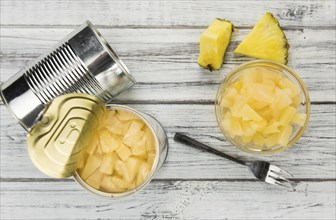 Preserved Pineapple pieces on a vintage background as detailed close-up shot, selective focus