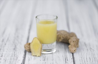 Portion of fresh Ginger Juice (selective focus, close-up shot)