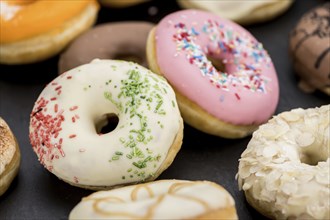 Portion of some Donuts as detailed close-up shot (fresh made, selective focus)