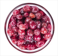 Preserved Cranberries as detailed close-up shot isolated on white background (selective focus)