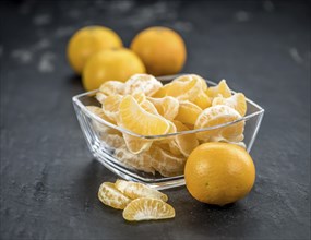 Portion of tangerines (close-up shot) on a vintage background (selective focus)