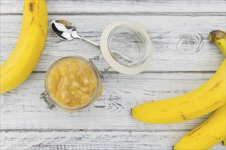 Mashed Bananas (selective focus, close-up shot) on a vintage background