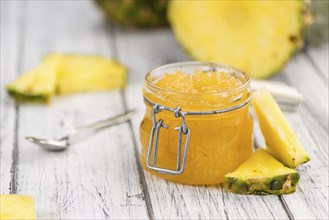 Fresh made Pineapple Jam on a vintage background as detailed close-up shot