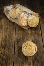 Fresh made German Buns on a vintage background as detailed close-up shot