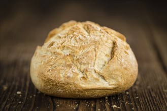 Rolls (German style) on rustic wooden background as close-up shot