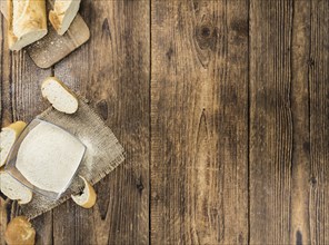 Some Bread Crumbs on a vintage wooden table (selective focus, close-up shot)