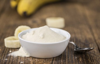 Banana Powder on rustic wooden background as close-up shot