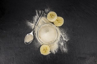 Portion of fresh Banana Powder close-up shot, selective focus