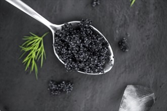 Portion of fresh Black Caviar (selective focus, close-up shot)