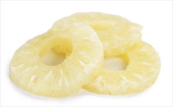 Portion of Preserved Pineapple Rings as detailed close-up shot isolated on white background