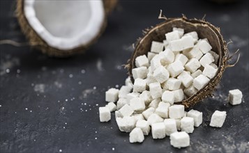 Portion of healthy Coconut dices (selective focus, close-up shot)