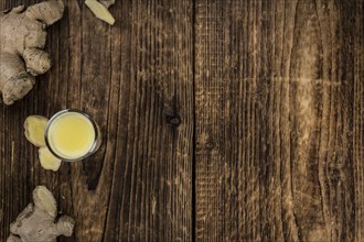 Portion of fresh Ginger Juice (selective focus, close-up shot)