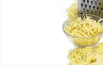 Grated Cheese isolated on white background (close-up shot, selective focus)