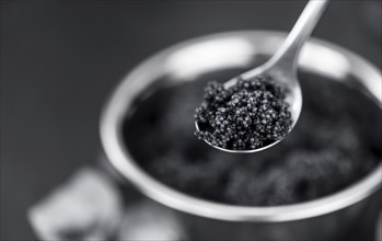 Portion of Black Caviar as detailed close-up shot, selective focus