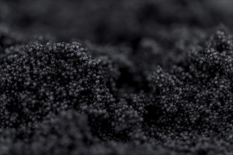 Portion of Black Caviar as detailed close-up shot, selective focus