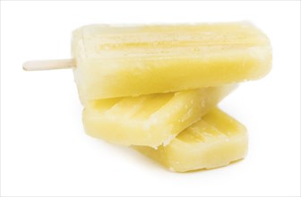 Homemade Pineapple Popsicles isolated on white background (close-up shot)