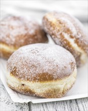 Portion of Berliner Doughnuts as detailed close-up shot, selective focus