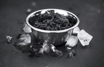 Portion of fresh Black Caviar (selective focus, close-up shot)