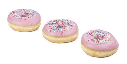 Some fresh made Donuts isolated on white background (close-up shot)