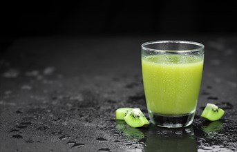 Fresh made Kiwi Smoothie (selective focus) on a vintage looking background