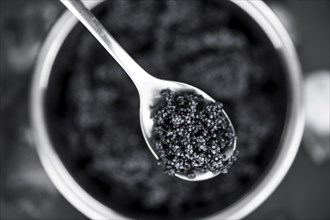 Portion of fresh Black Caviar (selective focus, close-up shot)