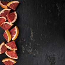 Chopped Grapefruits (selective focus) on a vintage background as detailed close-up shot