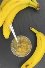 Mashed Bananas on a vintage background as detailed close-up shot (selective focus)