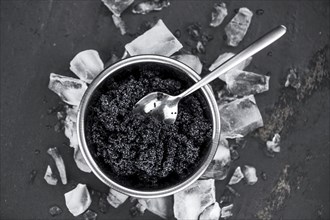 Portion of fresh Black Caviar (selective focus, close-up shot)