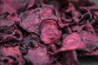 Fresh Beetroot Chips as detailed close-up shot (selective focus)