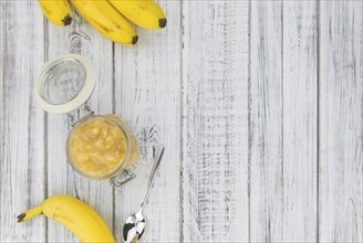 Mashed Bananas (selective focus, close-up shot) on a vintage background