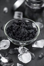 Portion of fresh Black Caviar (selective focus, close-up shot)