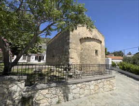 Exterior view from back with small apse of historic small single-nave church Panagia Throniotissa