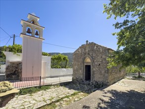 On the left, separate new bell tower on the right, historic small single-nave church of Panagia