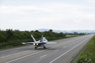 Swiss Air Force F/A 18 fighter aircraft take off and land on the A1 motorway during the Alpha Uno