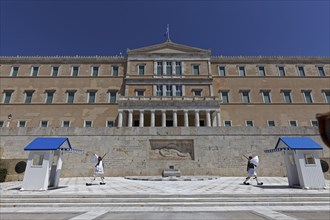 Parliament building with Evzones in traditional dress, blue sky, Athens, Greece, Europe