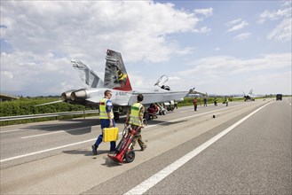 Swiss Air Force F/A 18 fighter aircraft take off and land on the A1 motorway during the Alpha Uno