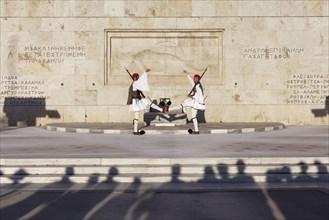 Two Evzones in traditional dress in front of the parliament building, Tomb of the Unknown Soldier,