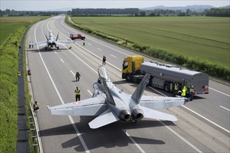 Swiss Air Force F/A 18 fighter aircraft take off and land on the A1 motorway during the Alpha Uno