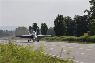 Swiss Air Force F/A 18 fighter aircraft take off and land on the A1 motorway during the Alpha Uno