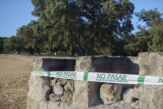 Stone barbecue in a picnic area with a fire hazard fire warning