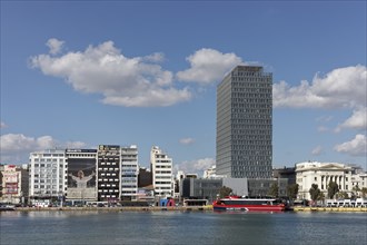 Harbour front with Piraeus Tower skyscraper, Kantharos Harbour, Piraeus, Athens, Attica, Greece,