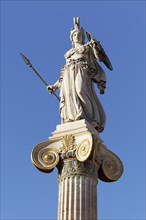 Column with statue of Athena in front of the Academy of Athens, blue sky, sculptor Leonidas Drosis,