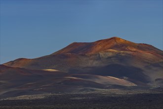 Sunrise in the Fire Mountains, volcanic landscape in Timanfaya National Park, Lanzarote, Canary