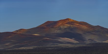 Sunrise in the Fire Mountains, volcanic landscape in Timanfaya National Park, Lanzarote, Canary