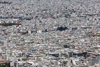 View of densely built-up metropolis, sea of houses without greenery, symbolic image concrete