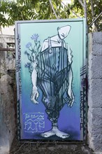 Bizarre figure in gardener's overalls, street art in the Anafiotika neighbourhood, Athens, Greece,