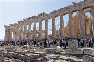 Parthenon north facade, in front of it many tourists, temple with Doric columns, Acropolis, Athens,