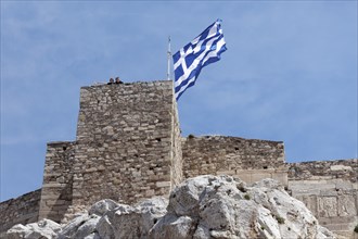 Greek national flag on the walls of the Acropolis, Athens, Greece, Europe