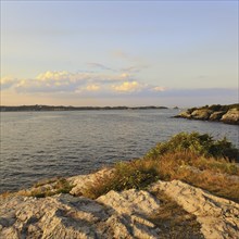 Seascape of Narragansett Bay at twilight from rocky cliffs of Castle Hill, Newport, Rhode Island,