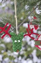 Funny green and red handmade reindeer Christmas ornament with pipe cleaner antlers and other red